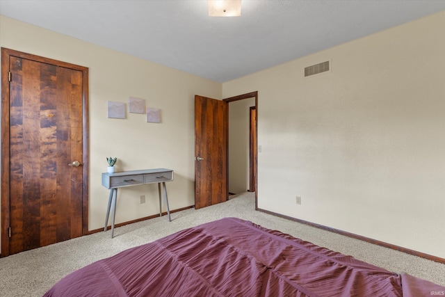 unfurnished bedroom with a closet and light colored carpet