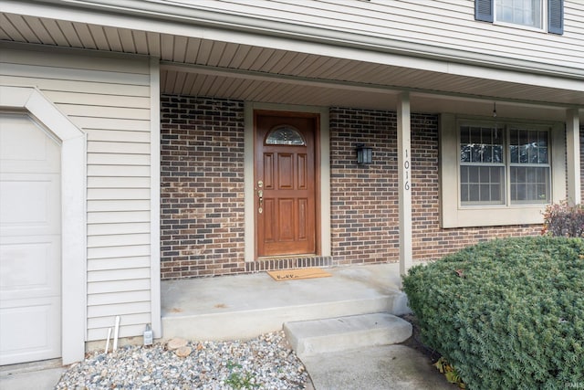 doorway to property with covered porch