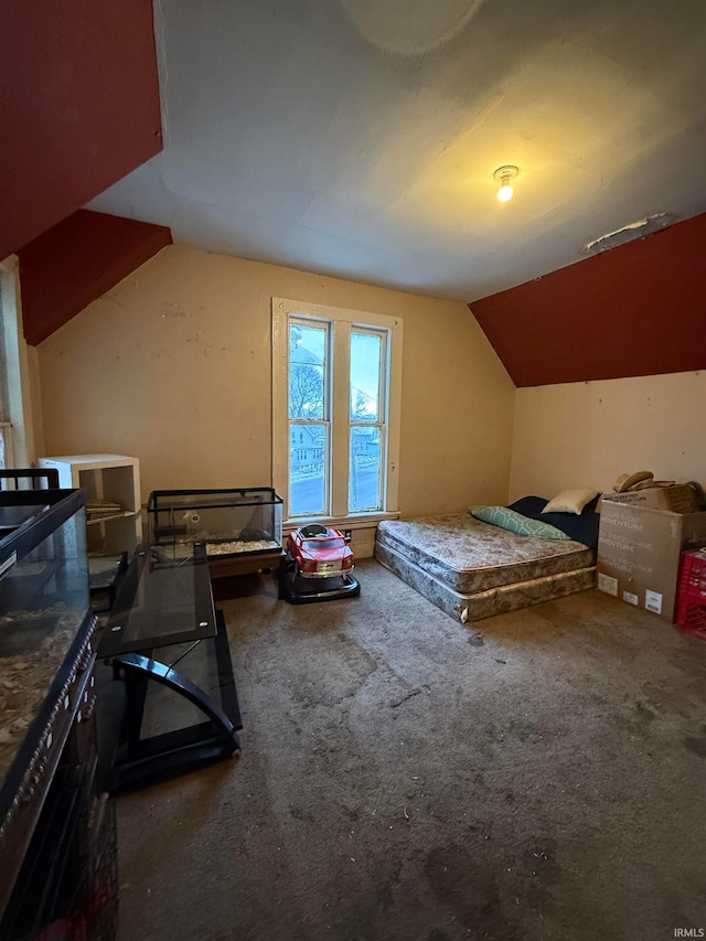 carpeted bedroom featuring vaulted ceiling