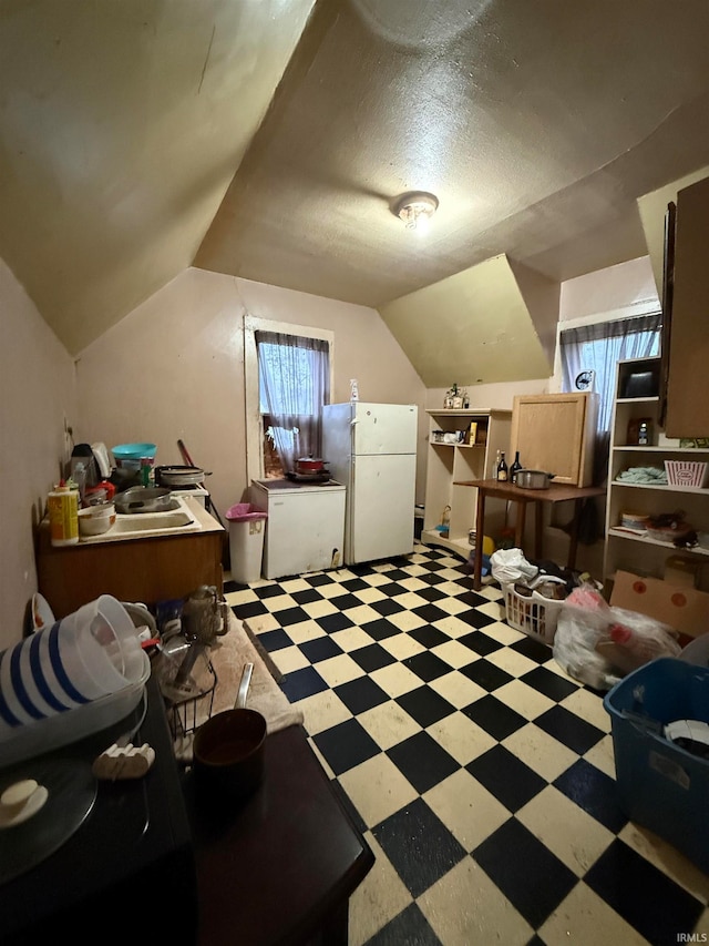 bonus room with lofted ceiling and a textured ceiling