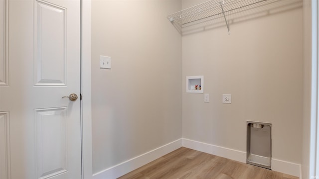 clothes washing area with light hardwood / wood-style floors, washer hookup, and hookup for an electric dryer