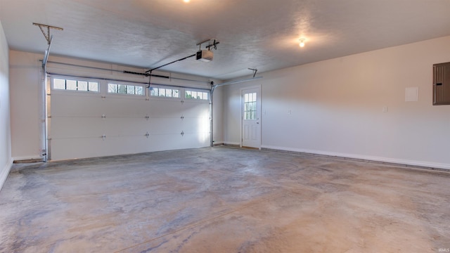 garage featuring a garage door opener and electric panel