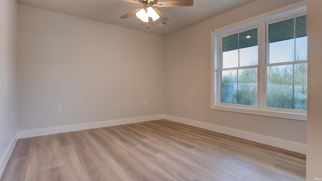 unfurnished room with ceiling fan and light wood-type flooring