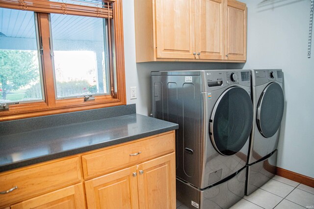 415 W 060 N, Lagrange, IN 46761 - laundry area with cabinet space, washing machine and dryer, light tile patterned floors, and baseboards