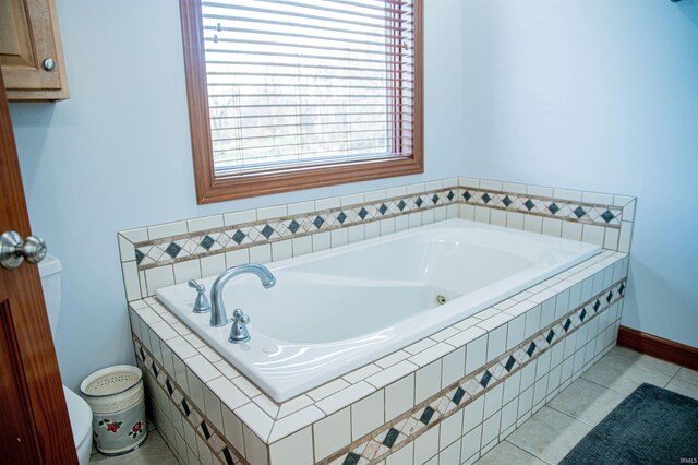 415 W 060 N, Lagrange, IN 46761 - bathroom featuring a whirlpool tub, toilet, tile patterned floors, and baseboards
