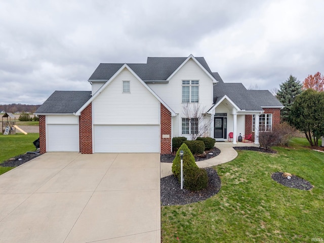 view of property featuring a garage and a front yard