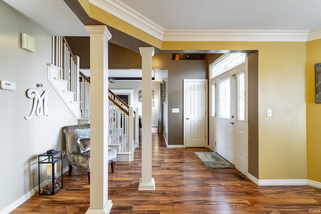 10229 Consta Verde Commons, Leo, IN 46765 - foyer entrance featuring ornate columns, stairway, wood finished floors, crown molding, and baseboards