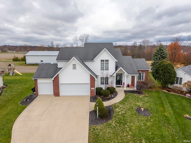 view of front of home featuring a front lawn and a garage