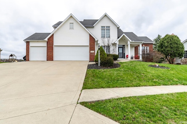 view of front of property featuring a front yard and a garage