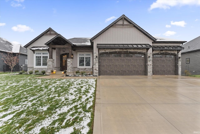 view of front of home with a yard and a garage