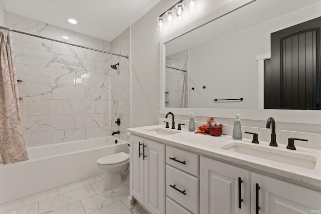 full bathroom featuring vanity, shower / bath combination with curtain, and toilet