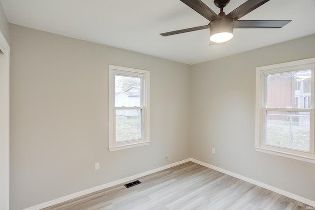 spare room featuring ceiling fan and light hardwood / wood-style flooring