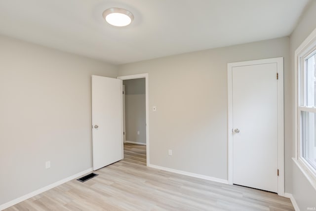 unfurnished bedroom featuring light hardwood / wood-style floors