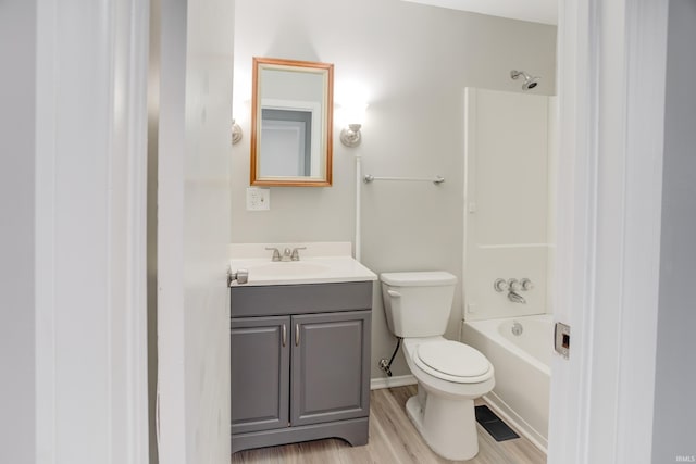 full bathroom featuring vanity, shower / bathtub combination, toilet, and wood-type flooring