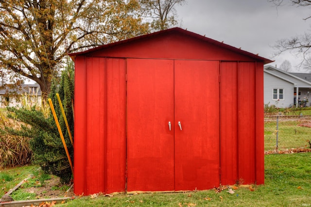 view of outbuilding featuring a yard