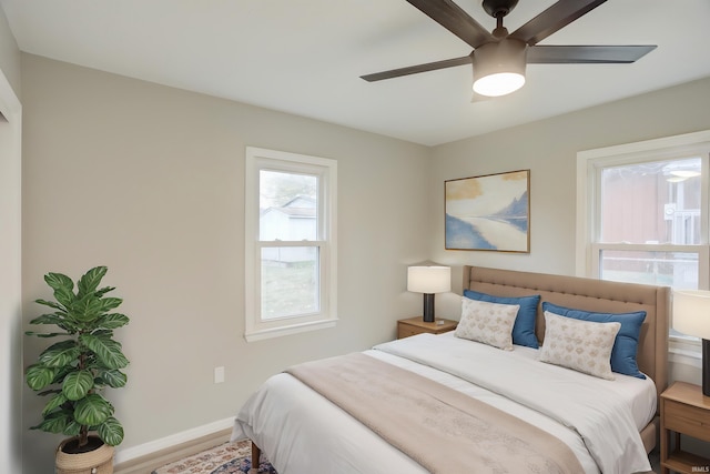 bedroom featuring ceiling fan and wood-type flooring