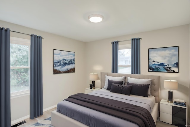 bedroom with light hardwood / wood-style floors