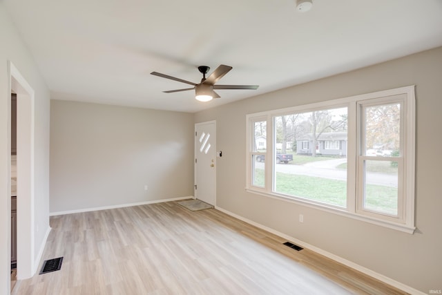 unfurnished room with ceiling fan and light hardwood / wood-style flooring