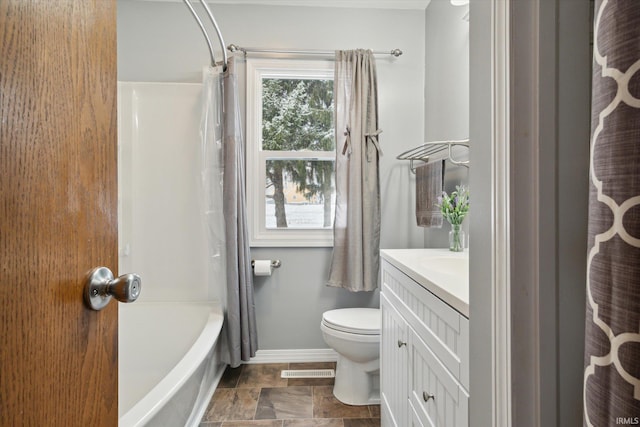 full bathroom featuring toilet, vanity, and shower / tub combo with curtain