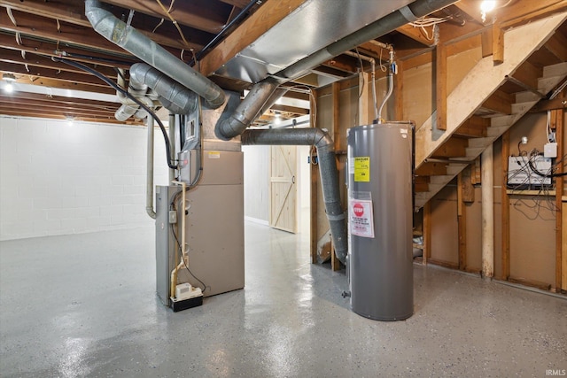 basement featuring heating unit and water heater