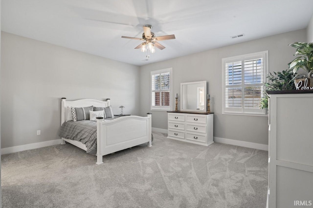 bedroom featuring ceiling fan and light colored carpet