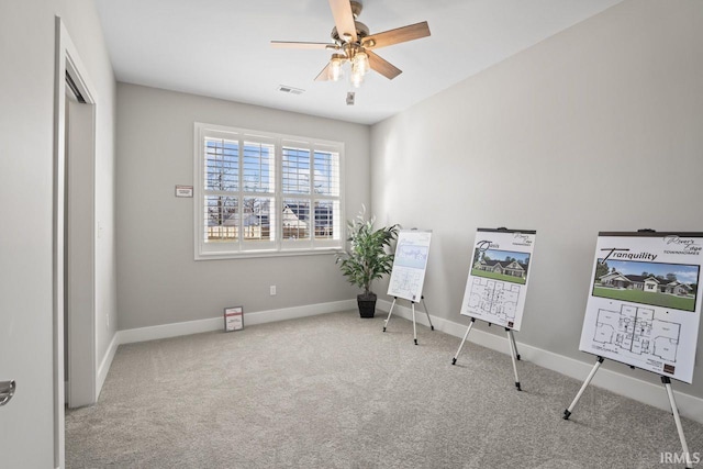 miscellaneous room with ceiling fan and light colored carpet