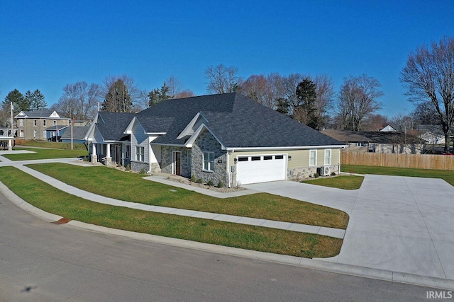 single story home featuring a front yard and a garage