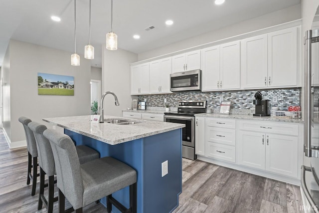 kitchen with white cabinets and stainless steel appliances