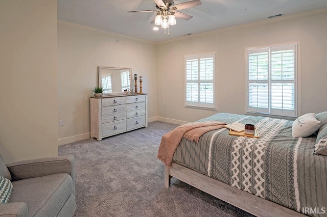 carpeted bedroom with ceiling fan and crown molding