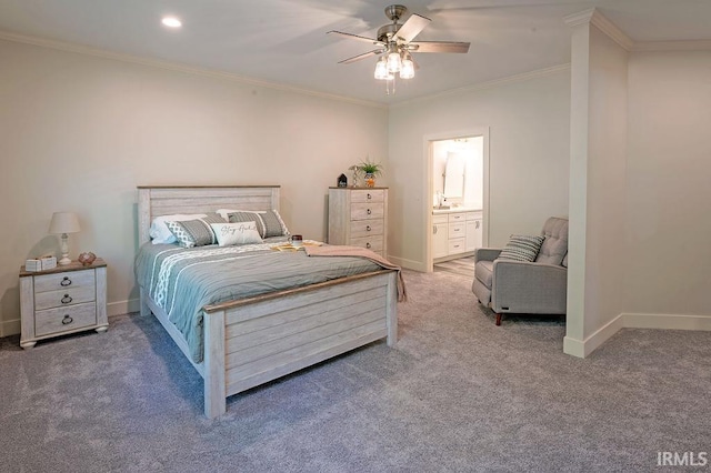 carpeted bedroom featuring ensuite bath, ceiling fan, and crown molding