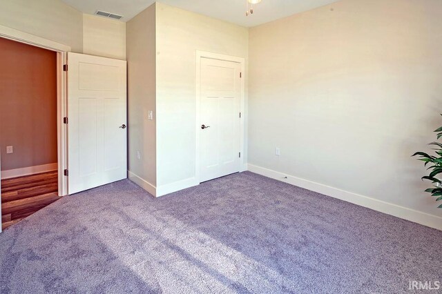 unfurnished bedroom with carpet floors