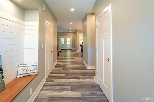 hall with dark hardwood / wood-style flooring and french doors