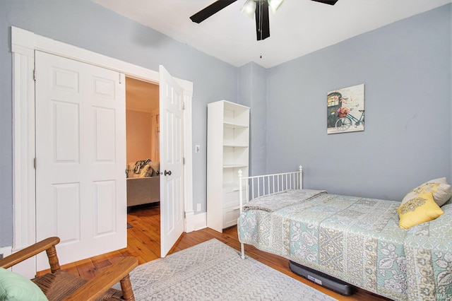 bedroom with hardwood / wood-style flooring and ceiling fan