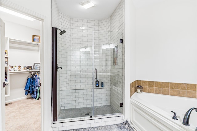 bathroom featuring plus walk in shower