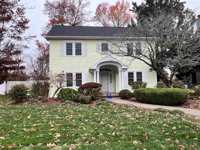 colonial-style house with a front yard