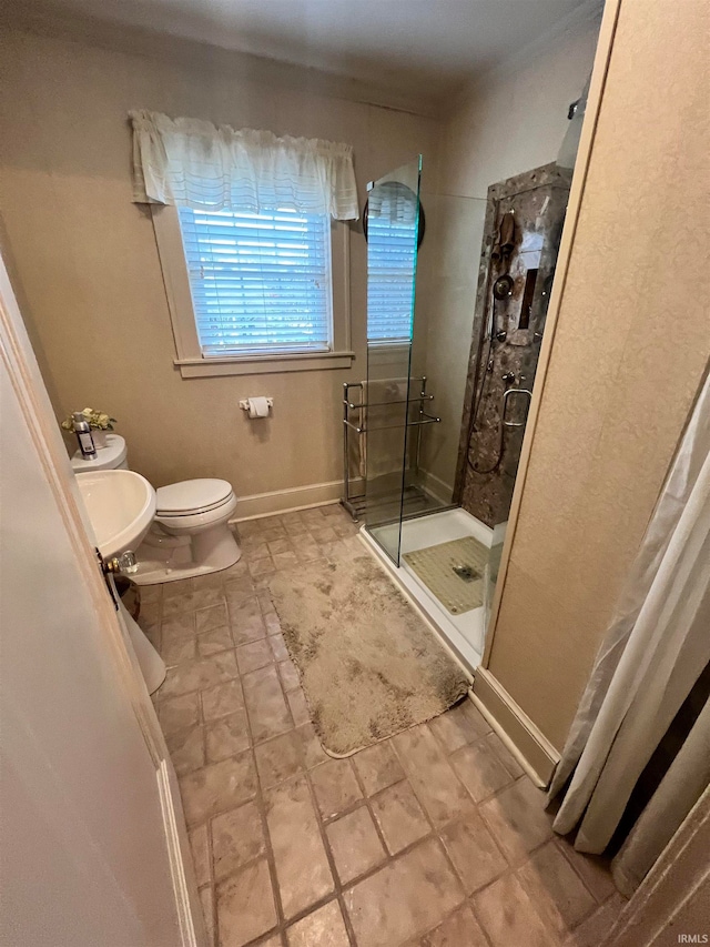 bathroom featuring toilet and walk in shower