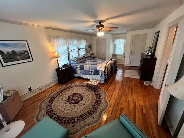 bedroom with hardwood / wood-style flooring and ceiling fan