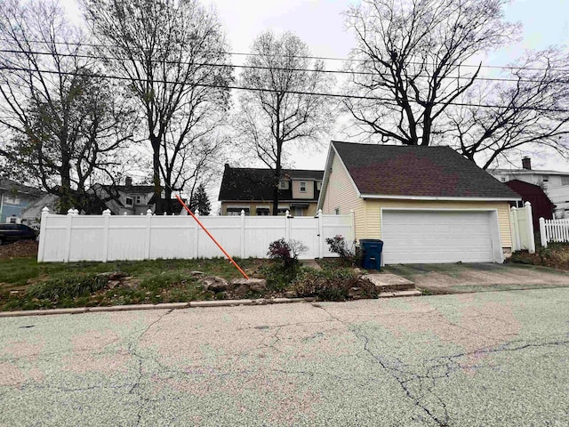 view of side of property with a garage