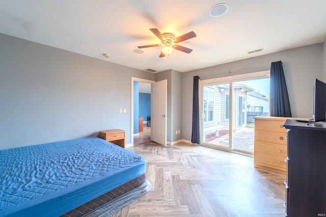 bedroom with ceiling fan, access to outside, and light parquet flooring