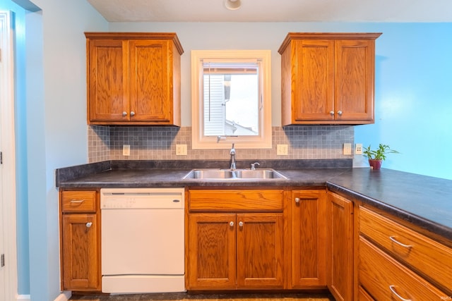 kitchen with dishwasher, sink, and tasteful backsplash