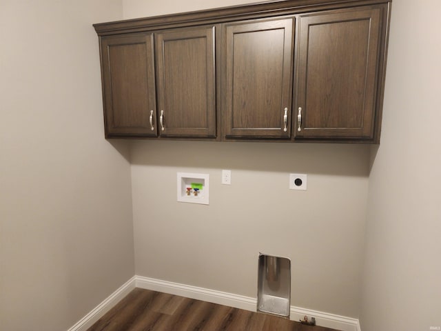 laundry room featuring cabinets, washer hookup, dark wood-type flooring, and hookup for an electric dryer