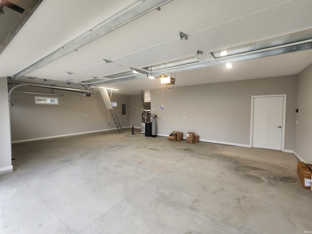 garage featuring electric panel, water heater, and a garage door opener