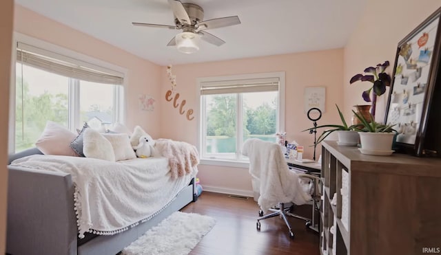 bedroom featuring ceiling fan and dark hardwood / wood-style flooring