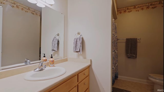 bathroom with vanity and toilet