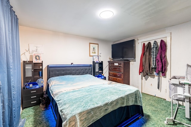 bedroom with dark colored carpet