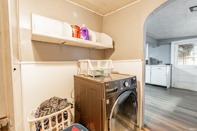 washroom featuring washer / dryer and dark wood-type flooring