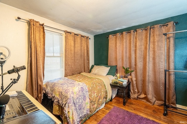 bedroom featuring hardwood / wood-style floors