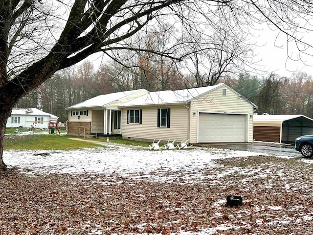 single story home featuring a garage and a carport