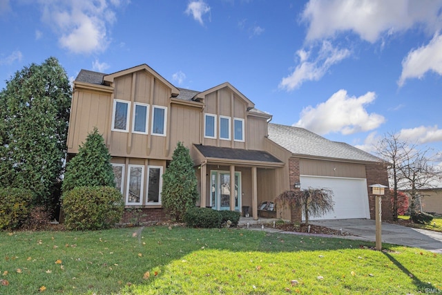 view of front of house with a front yard and a garage