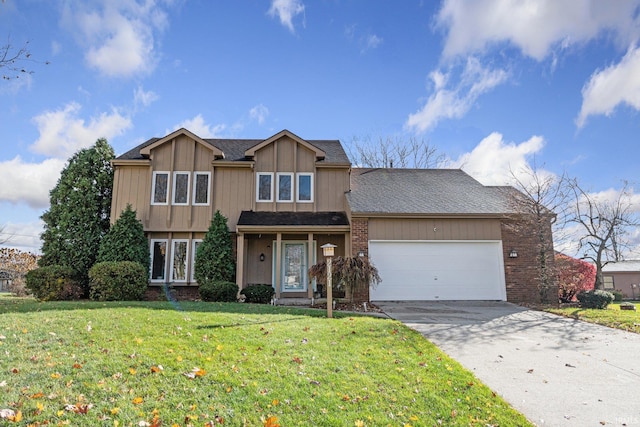 view of front of home with a front yard and a garage